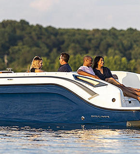People relaxing on a blue Bayliner boat