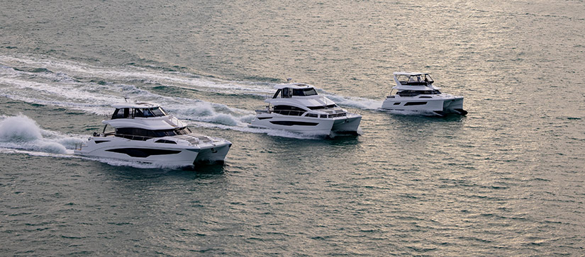 Three Aquila Power Catamarans running on the water