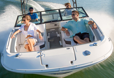 Group relaxing on boat while speeding across water