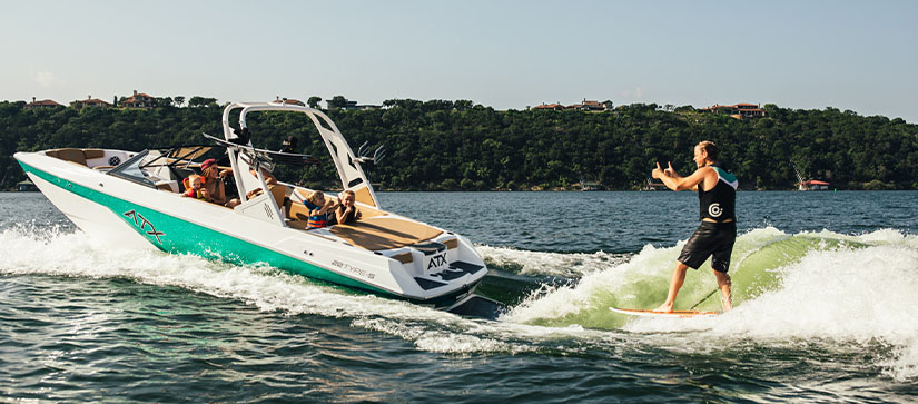 An ATX boat towing a water skier