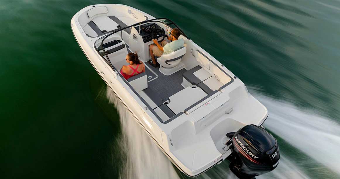 Two people riding on a Bayliner boat