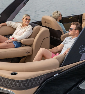 Two people relaxing on a Barletta pontoon