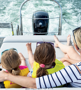 Woman and kids on the rear of a Harris pontoon