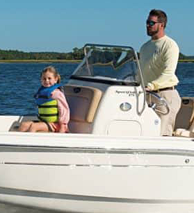 Man and young girl on a Scout boat