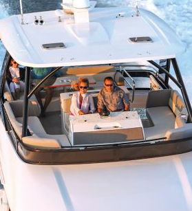 Couple at the helm of a Tiara Yacht