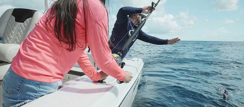 People fishing on a Sailfish boat