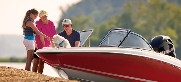 Family with a dog and a boat
