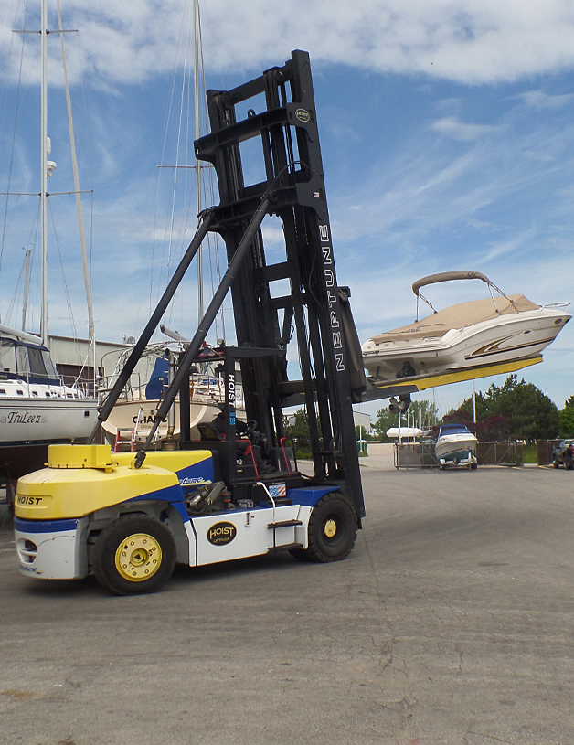 Forklift moving a boat