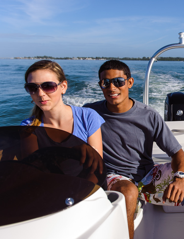 Couple driving a boat