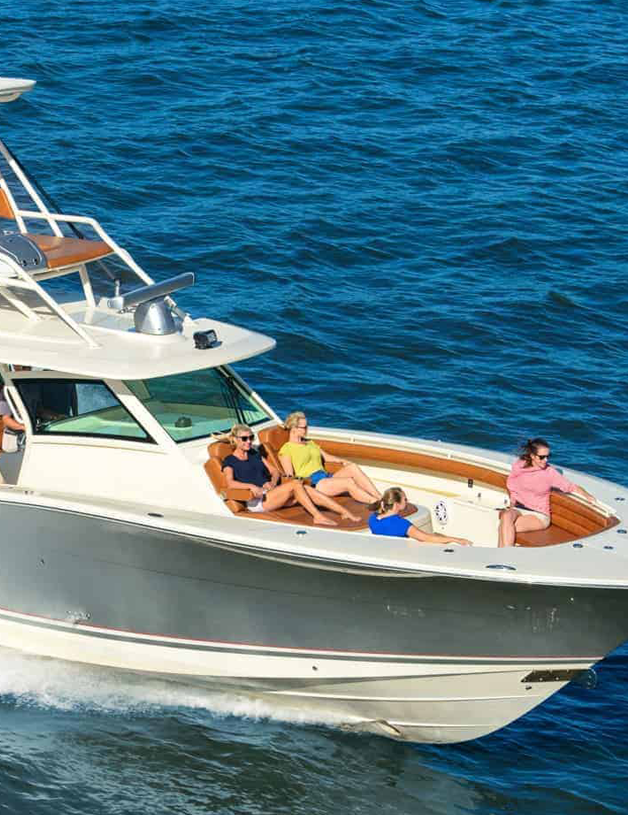 Four women relaxing in bow seating of a boat