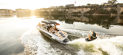 person wake boarding behind a tige ultre